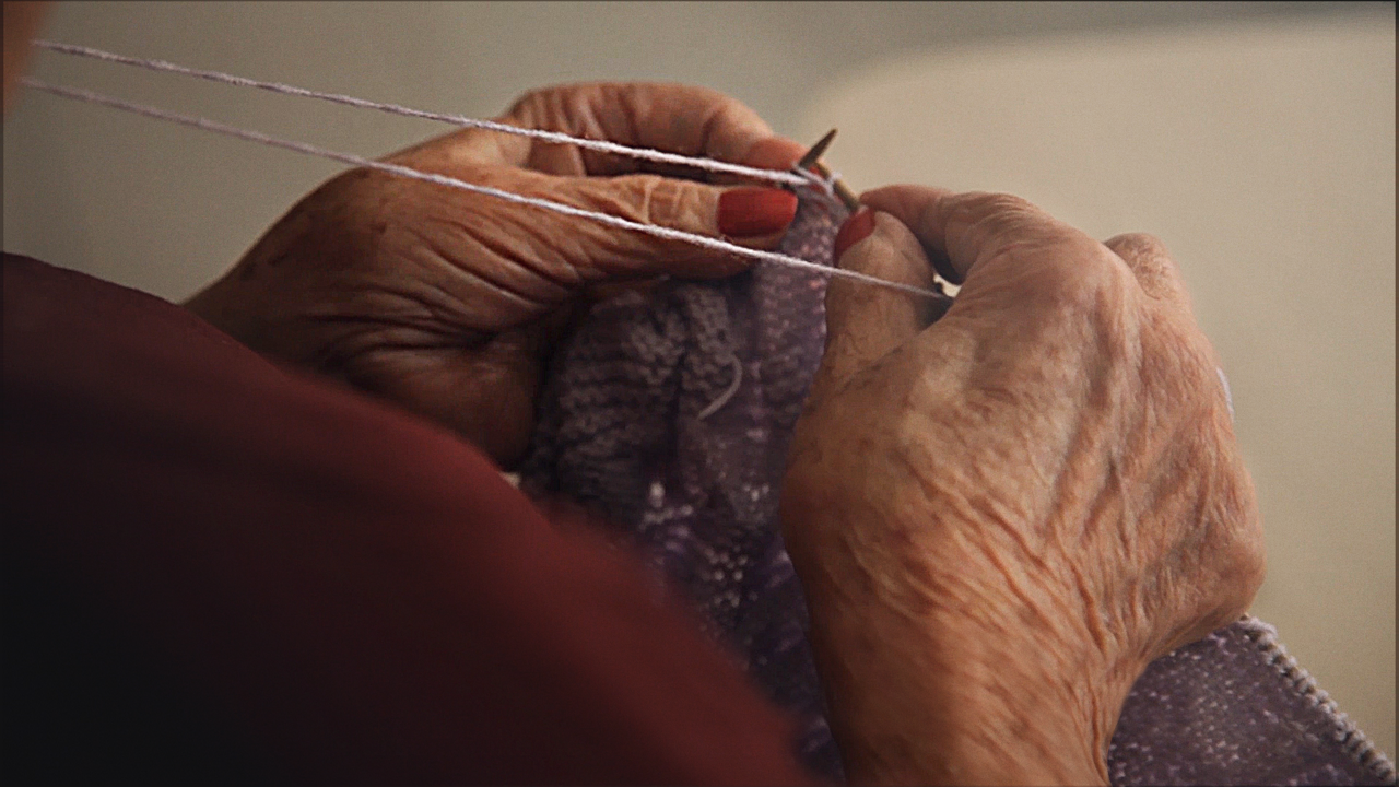 Alzheimers elderly hands knitting smaller