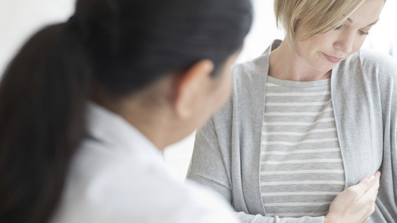 Doctor with female patient during consulation