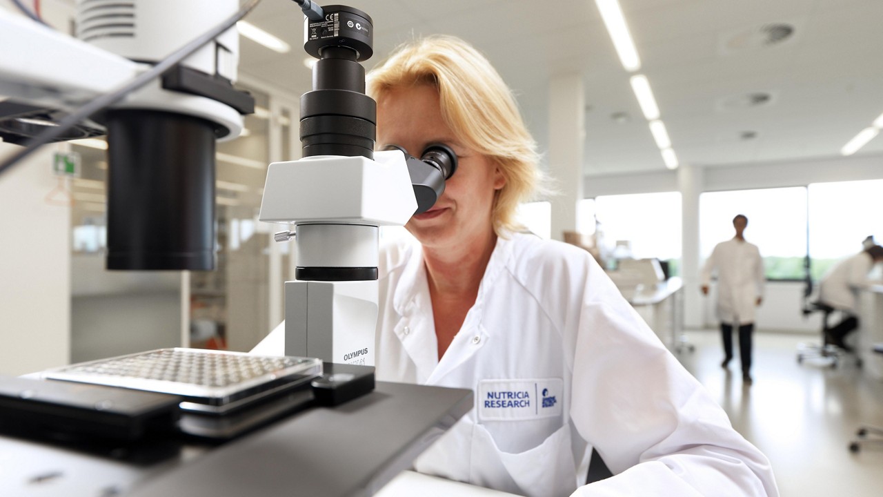 Nutricia utrecht scientist looking microscope