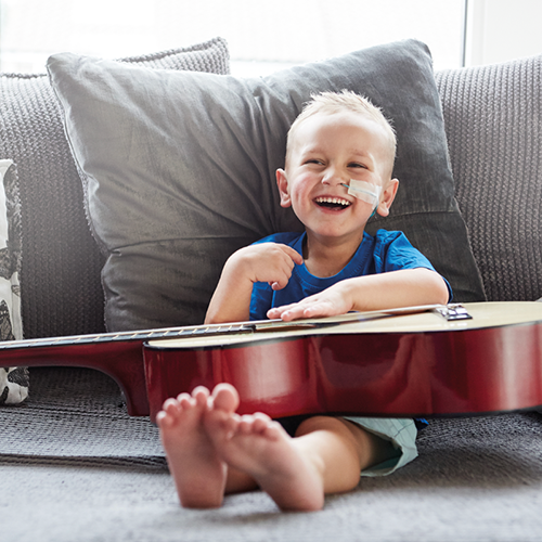 Pediatric DRM happy boy guitar