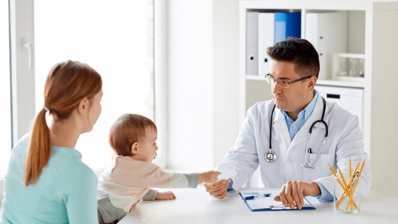 woman-with-baby-and-doctor-at-clinic.png