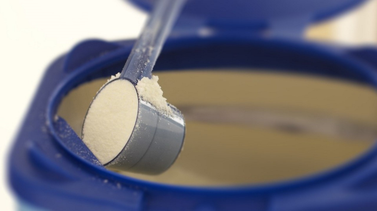 Baby formula powder being scooped