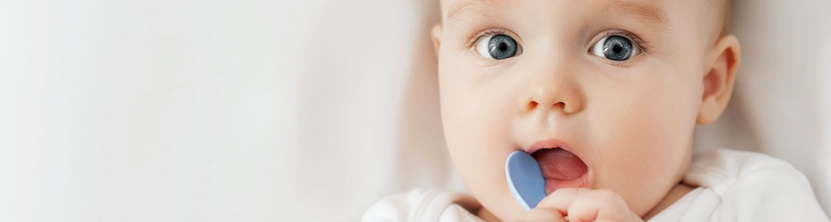 Baby holding a spoon