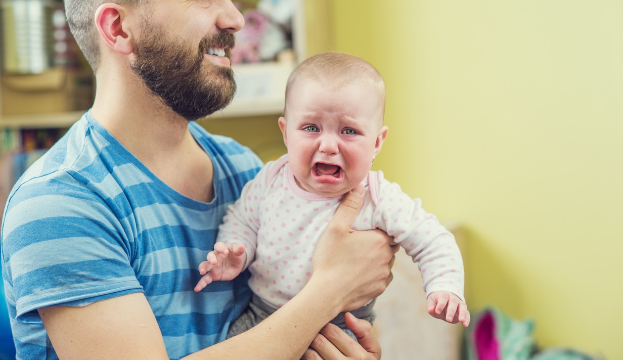 Crying baby dad arms