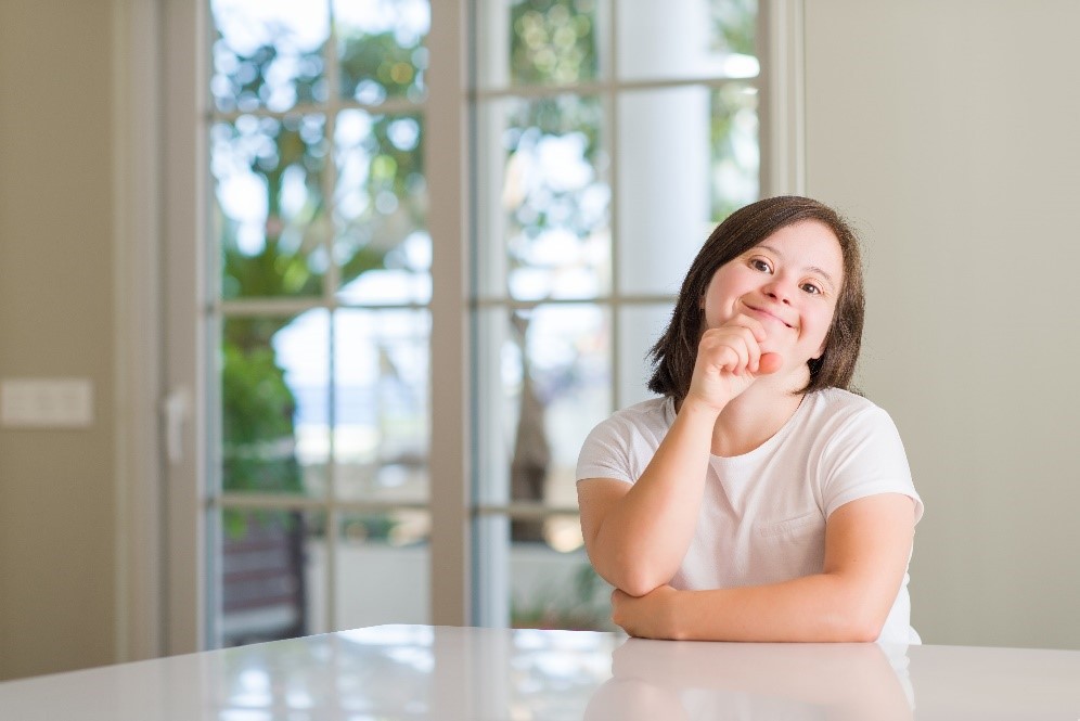 happy-girl-sitting-at-a-table.jpg