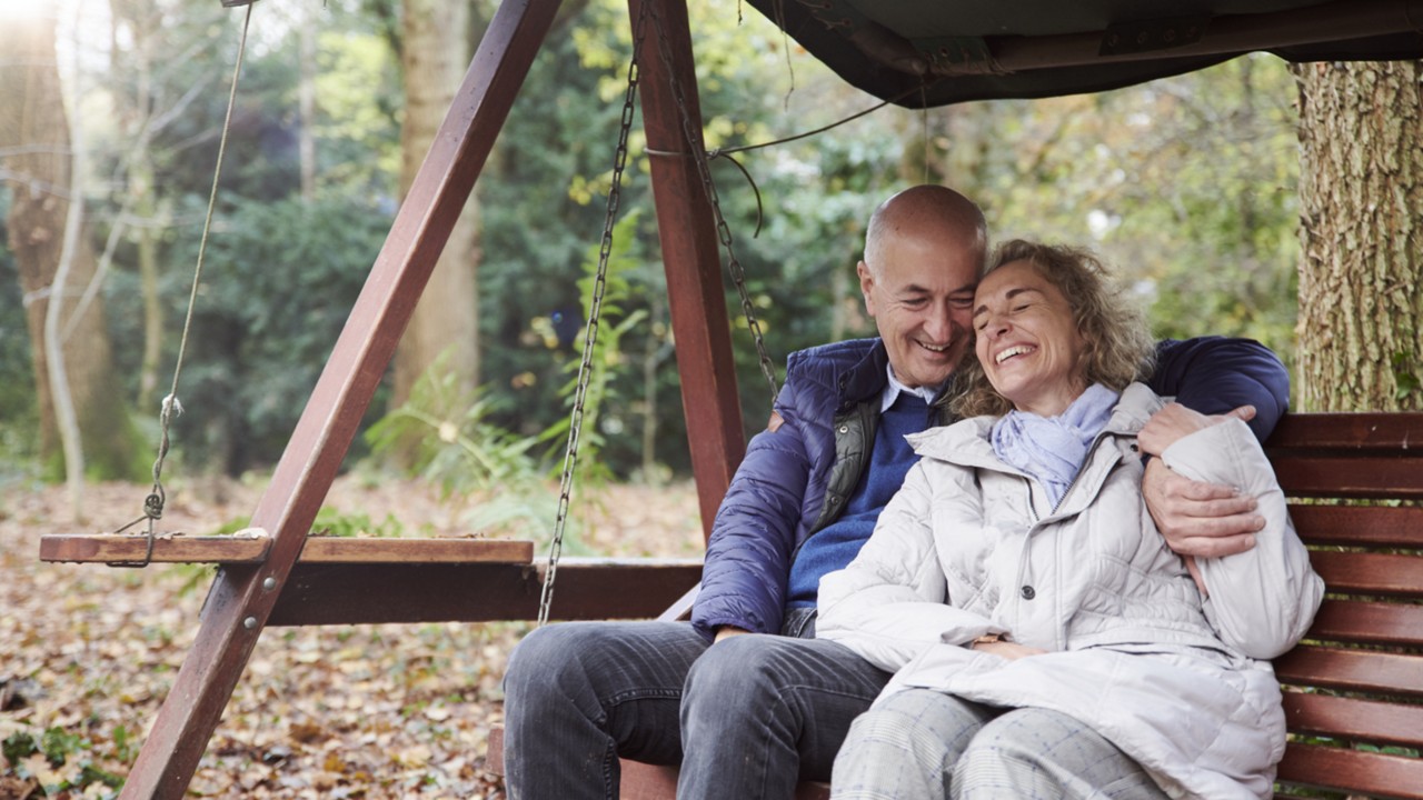 Nutricia eldery couple sitting on garden bench