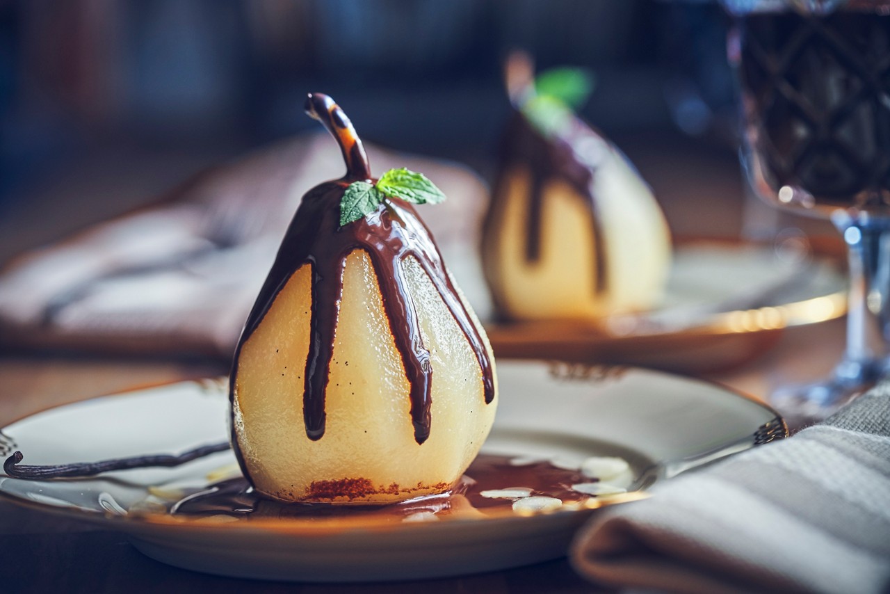Poached Pears in Vanilla Lemon Syrup glazed with Dark Chocolate