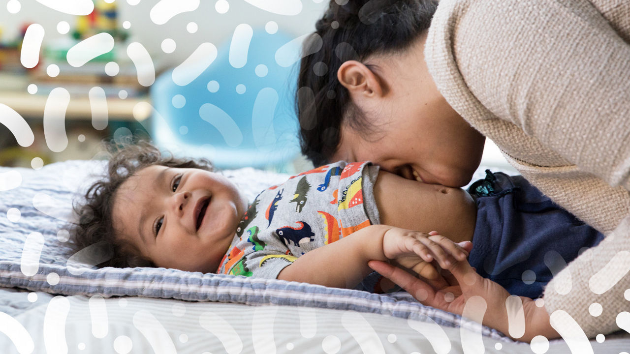 Breastfeeding baby on bed