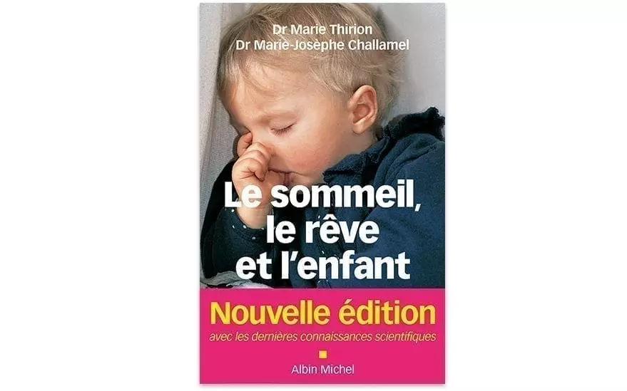 Couverture du livre � Le sommeil, le reve et l'enfant � du Dr Marie Thirion et du Dr Marie-Josephe Challamel. Le design presente une palette de couleurs rose et blanche avec un texte en gras et une image floue d'un enfant. Le sous-titre met en evidence � Nouvelle edition � et mentionne les connaissances scientifiques actualisees. Publie par Albin Michel.