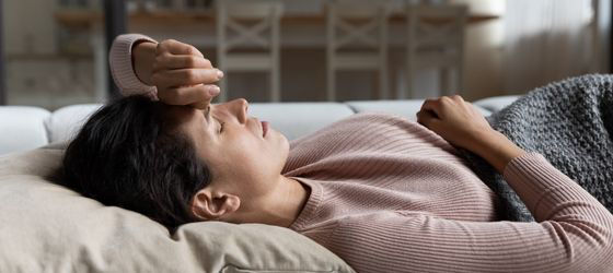 Woman lying on a couch resting