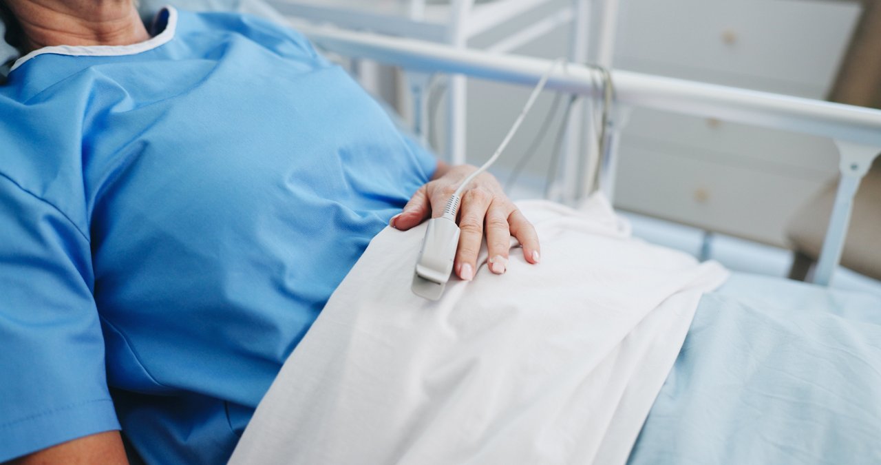 Patient sleeping in hospital bed