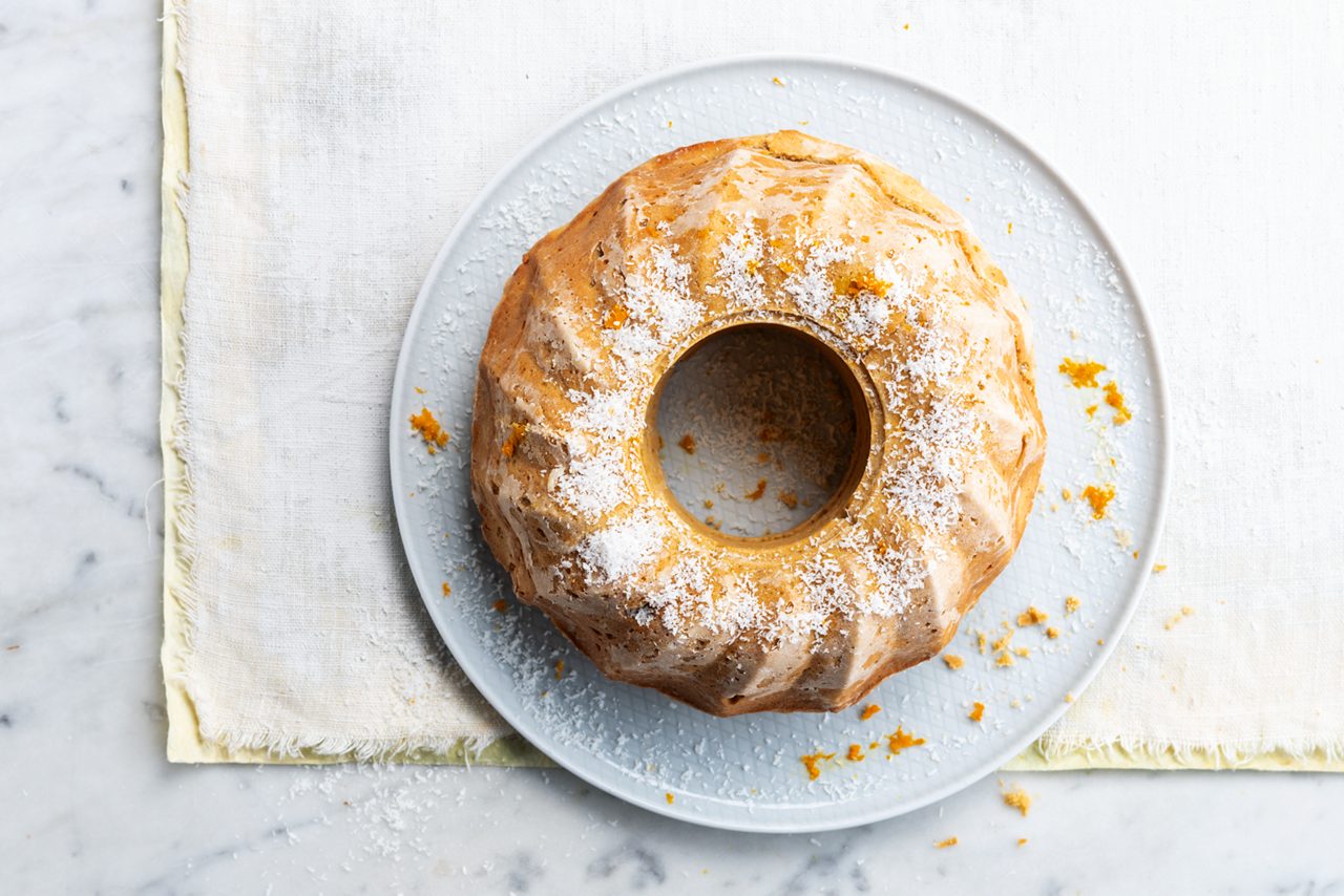 8B934786-75C8-45B9-8039032812C6A4EE<br>A_GFY_NA_Master_Recipe_Image_Ciambellone__Drinks_NA_oat_NA_TetraUHT_1l_HR_horizontal-170.tif<br>Orange and Lemon Italian Bundt Cake
A traditional festive cake made even more delicious with Alpro plant based alternative to yoghurt Vanilla
"
210g wholegrain plain flour
2 tsp baking powder
½ tsp salt
120g castor sugar 
Zest of one orange + extra
Zest of one lemon
3 large eggs, at room temperature 
180g Alpro plant based alternative of yoghurt Vanilla 
120ml melted coconut oil
2 tbsp desiccated coconut


"
"1. First off, preheat your oven to 175°C. Prep a 25cm bundt cake tin by brushing with melted coconut oil and dusting with flour. 
2. In a bowl, sift together the flour, baking powder and salt. In another bowl, use an electric mixer to blend the orange and lemon zest together with the sugar. Add the eggs and mix well until light and fluffy. Then add the Alpro plant based alternative of yoghurt Vanilla  and coconut oil and mix again. Using a large metal spoon, fold the flour little by little into the liquid batter and stir until it's all blended in.
3. Pour the batter into the bundt tin and bake for 30-35 minutes, until just beginning to turn golden and a testing needle comes out clean. (For a perfectly moist cake, don't overbake!) 
4. Leave the cake in the mould and let it cool for 10 minutes on a rack. Then tip it out of the tin and top with a sprinkle of coconut and the rest of the orange zest. Delicious warm on its own or with a dollop of something creamily plant-based!"
lactose free, veggie
/Orange_and_Lemon_Italian_bundt_cake
(Recipe type: DESSERT/AFTERNOON TEA (Prep time: 15 min) (cooking time: 20 min) (cooling time: 5 minuten) (servings: +/- 6-8 persons) (season: all season)
/
/
Add a sprinkle thyme leaves for an extra hint of Mediterranean sunshine 
/
Alpro Plant Based Alternative to Yoghurt Vanilla
Alpro, Alpro recipe, vanilla, cake, desert, tea-time, treat, baking, bundt cake, coconut, orange, lemon