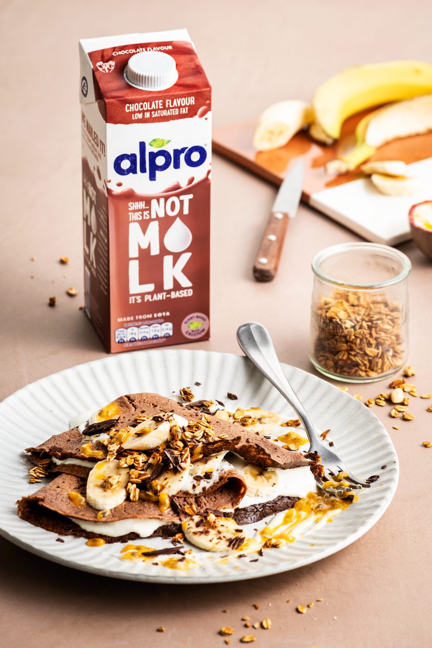 C151973C-EF01-4FFD-81C6C10D1D7ACCA1<br>A_NotMilk_Product_Recipe_Image____Drinks_NA_Oat_NA_TetraUHT_1l_HR_NotMilk_chocolate_pancake-062.tif<br>"600 ml Alpro This is Not M*lk chocolate flavour
90 g Oat flour
90 g Rice flour
1 tbsp Baking powder
3 tbsp Cornflour
1 tbsp mixed seeds (flaxseeds, chia, sunflower seeds)
2 Banana’s 
120 ml water
To serve: Alpro plant based alternative to yoghurt of choice, granola, fruit of choice
"
"""Place the Alpro This is Not M*lk chocolate flavour, oat flour, rice flour, baking powder, cornflour, mixed seeds, banana and water in a blender and mix to a smooth batter. 
Heat a large crepe pan with coconut oil and bake the crepes till golden brown. 
Bake till all the batter is done. 
To serve the crepes: roll up or fold and serve with Alpro plant based alternative to yoghurt of choice, fruit and granola.
To have the ultimate combination, try Alpro plant based alternative to yoghurt coconut with banana, passionfruit and some chopped dark chocolate. 
"""
Vegan, lactose-free
/chocolate-flavour-breakfast-crepes-with-fruit-and-granola
(Recipe type: Breakfast (Prep time: 10 min) (baking time: 10 min) (cooling time: X ) (servings: for 8 large pancakes ) (season: all season)
xx
xx
xx
use gluten-free flour
Alpro This is Not M*lk chocolate flavour
Alpro, Alpro recipe, NOT MILK, chocolate, pancakes, banana, breakfast pancakes, crepes, lactose-free