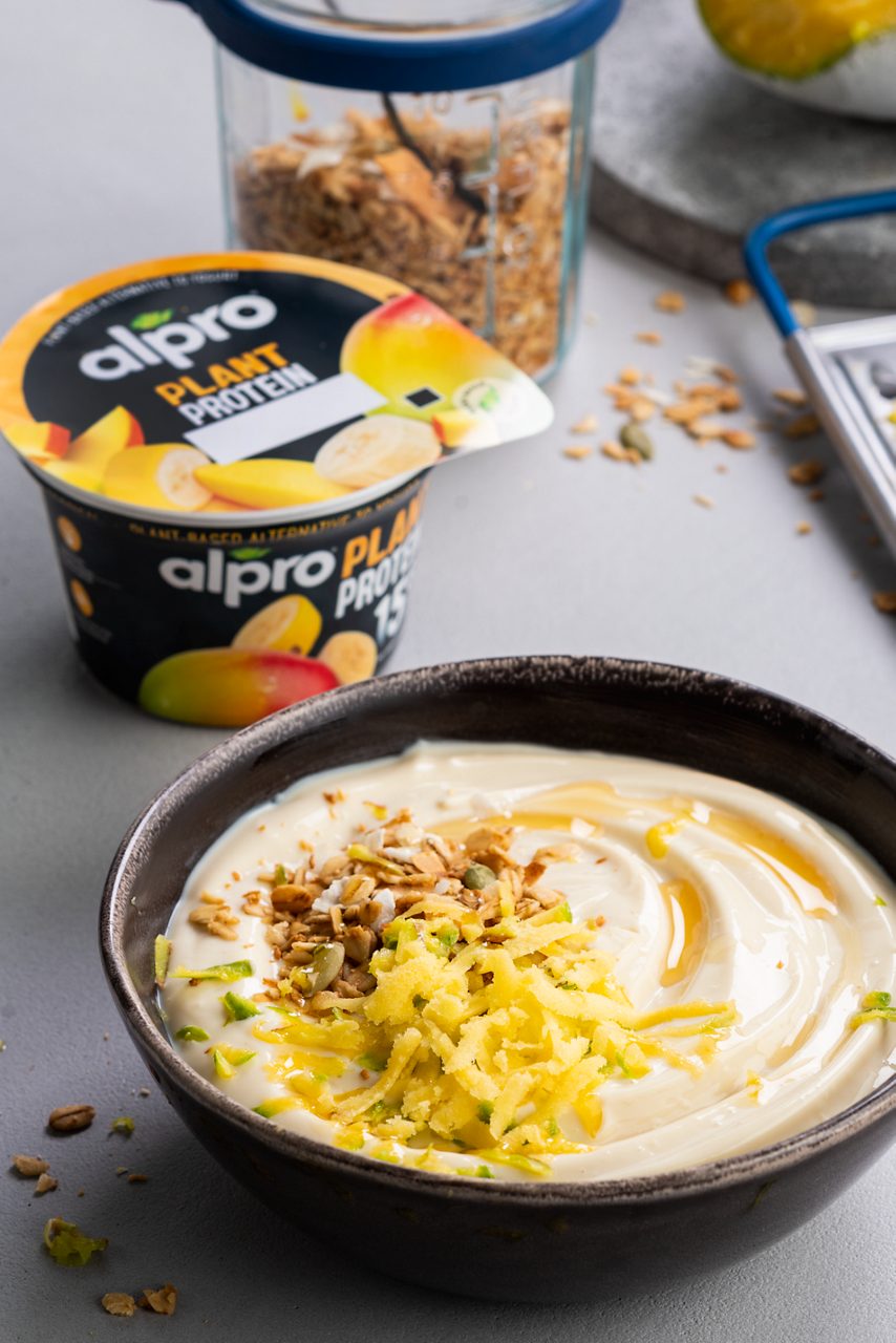 80973763-0B26-4BE9-83385CBFAA34245D<br>A_FYY_NA_Master_Recipe_Image_FrozenMangoBowl__NA_PBAY_Protein_Soy_NA_Pot_200g_HR_Protein_Tropical_CROP-045.tif<br>grated_frozen_mango_breakfast_bowl_title	Tropical mango breakfast bowl
grated_frozen_mango_breakfast_bowl_subtitle	Start your day the tropical way. Slow and easy! 
grated_frozen_mango_breakfast_bowl_ingredients	"1 pot Alpro Plant Protein Tropical
½ mango
1 tbsp maple syrup
2 tbsp toasted coconut granola"
grated_frozen_mango_breakfast_bowl_preparation	"1 Freeze the mango – or any fruit you fancy or have left over – overnight.
2 The breakfast bowl fun begins! Start with generous dollops of Alpro Plant Protein Tropical.
3 Grate the frozen mango over the top and finish with maple syrup and granola.
4 One mouthful and you're chilling on your own personal paradise island!"
grated_frozen_mango_breakfast_bowl_tags	Vegan
grated_frozen_mango_breakfast_bowl_url	/grated-frozen-mango-breakfast-bowl
grated_frozen_mango_breakfast_bowl_info	(Recipe type: Breakfast/snack (Prep time: 5 min) (baking time: x) (cooling time: overnight ) (servings: for 1 serving ) (season: all season)
grated_frozen_mango_breakfast_bowl_lactosetip	xx
grated_frozen_mango_breakfast_bowl_fruit_tip	Use any fruit you prefer
grated_frozen_mango_breakfast_bowl_trendtip	 
grated_frozen_mango_breakfast_bowl_glutentip	Use gluten-free granola
grated_frozen_mango_breakfast_bowl_product	Alpro Plant Protein Tropical
grated_frozen_mango_breakfast_bowl_searchterms	Alpro, Alpro recipe, protein, breakfast bowl, breakfast, plantbase, vegan, healthy snack, protein packed, trend, frozen fruit