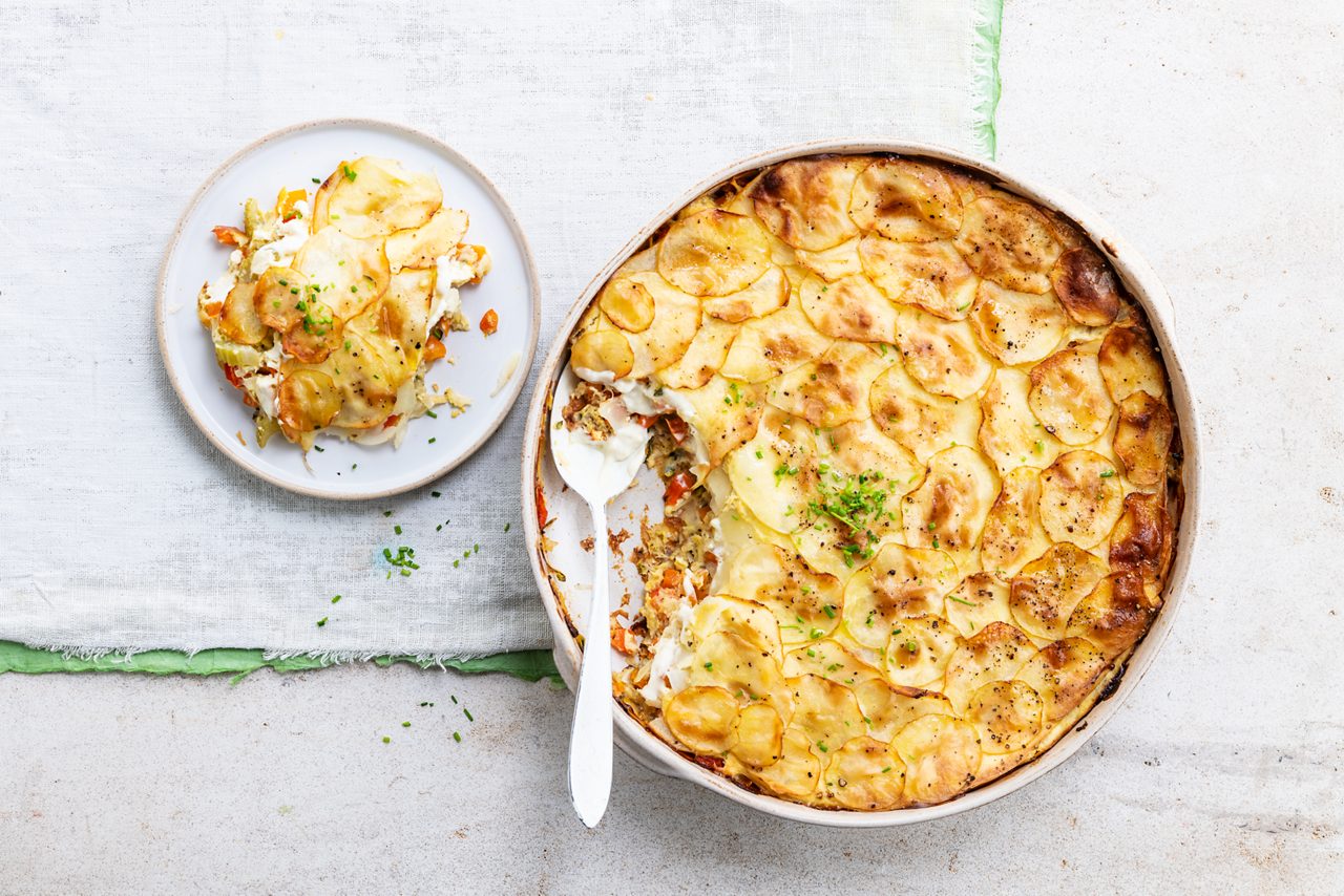 0E618C9C-9382-49BE-90F18104A46CB966<br>A_UK_Recipe_Image_DauphinoiseToppedVegetablePie_PBAY_UK_GreekStyle_Plain _500g_HR_horizontal-708.tif<br>Dauphinoise topped vegetable pie
A golden gratin worthy of any feast, made with Alpro Greek Style
"2 carrots, peeled & grated or finely chopped in a food processor
1 small celeriac, peeled & grated
1 courgette, grated
1 parsnip, peeled & grated
2 onions, grated
1 red pepper, deseeded & finely chopped
2 cloves of garlic, grated
2-3 tbsp olive oil, to sauté and for brushing
450g potatoes, peeled & finely sliced (2-3 mm thick)
400ml Alpro Greek Style 
½ tbsp smoked paprika
Handful of chopped herbs (chives, dill, parsley..) 
"
"1. Preheat your oven to 180ºC fan, 220ºC conventional, gas 7. In a large bowl, mix together the grated veg, red pepper and one clove of grated garlic. 
2. Heat the olive oil in a pan, and gently sauté the veggie mix for 5 minutes. Add a twist of salt and pepper, pile into a large, shallow ovenproof dish and level off the top.
3. In a small bowl, pop in the Alpro Greek Style, smoked paprika, the remaining grated garlic clove and the chopped herbs and mix it all together. Season to taste with salt and pepper. Spread half the mix over the top of the veg.
4. Cover with half of the finely sliced potato and season with salt and pepper. Spread over the rest of the creamy mixture. Add another layer of potato slices, maybe making a pretty pattern as you go. Brush the top with a generous coating of olive oil. Season with a final twist of freshly ground salt and pepper. 
5. Bake in the oven for 40 minutes or until the top goes a gorgeous golden brown. Serve, sit back and bask in the glory!
"
vegan, veggie, lactose free, gluten free
/vegan-potato-gratin-with-veggies
(Recipe type: DINNER/SIDE DISH (Prep time: 30 min) (baking time: 40 min) (servings: 6 persons) (season: all year)