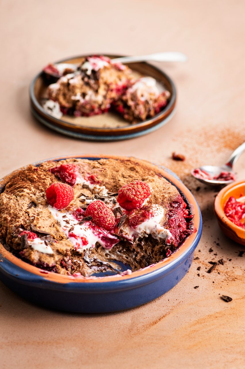 E00D611D-9670-4792-9539674FC0B8A67A<br>A_NotMilk_Product_Recipe_Image____Drinks_NA_Oat_NA_TetraUHT_1l_HR_NotMilk_chocolate_lavacake-156<br>"120 g Frozen raspberries
180 g Alpro This is Nol M*lk chocolate flavour
155 g whole wheat flour
2 tsp baking powder
2 tbsp coconut sugar
45 g coconut oil, melted
40 g chocolate drops or chopped 80% dark chocolate , plus extra chopped for serving
Alpro vanilla plant based alternative to yoghurt
1 tsp cacao powder, to serve with
Fresh raspberries, to serve with

"
"""Preheat the oven to 180°C. Prepare a waterbath for your ramekins or one large baking dish.
Add the frozen raspberries to your baking dish. Place in the microwave for 3 minutes till soft. Crush using a fork and leave aside till needed. 
Mix together the Alpro This is Not M*lk chocolate flavour, flour, baking powder, coconut sugar and oil. Mix to a smooth batter.
Add the batter to the baking dish, the raspberries will come to the surface, that's no problem. 
Place the dish in the waterbath and bake in the oven for 15-20 minutes till cooked. Remove from the oven and serve warm with Alpro vanilla plant based alternative to yoghurt, raspberries, chopped chocolate and cacao powder. """
Vegan, lactose-free
/chocolate-and-raspberry-baked-dessert
(Recipe type: Dessert (Prep time: 10 min) (baking time: 20 min) (cooling time: X ) (servings: 4-5 servings ) (season: all season)
xx
xx
use any fruit of choice
use gluten-free flour
Alpro This is Not M*lk chocolate flavour
Alpro, Alpro recipe, NOT MILK, chocolate, dessert, healthy dessert, baked dessert, raspberries, pudding, lactose-free