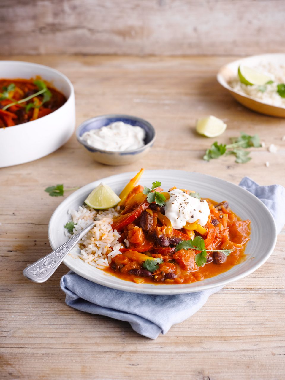 3EED3122-160D-4C97-A76319439D166305<br>VEGGIE CHILI_00044.tif<br>"800g canned chopped tomatoes
2 onions
2 garlic cloves, finely chopped
2 bell peppers, red and yellow
400g canned red kidney beans, drained and rinsed
2 tsp garam masala
couple of sprigs cilantro
1 cube of vegetable stock
Lime
2 tbsp Olive oil
100 ml water 
175ml Alpro GoOn Plain
pepper and salt"
"1. Chop the onion and garlic and slice the bell pepper, remove the seeds and chop in thin slices. Drain and rinse the red kidney beans. 
2. Heat up the olive oil in a heavy frying pan with a lid and add the onions and garlic. Let them soften while stirring occasionally. Add the garam masala and a couple of springs cilantro to the onions. Stir-fry for 1 minute, then add the tomatoes, bell peppers and water. Add a crumbled vegetable stock cube and stir. Cover the pan and let simmer for 15 minutes while stirring occasionally.
3. Add the red kidney beans to the pan and season with lime juice, pepper and salt. Add extra water if it’s looking dry. 
4. Serve the veggie chili with fresh cilantro, lime, Alpro Go On and bread or rice.   "