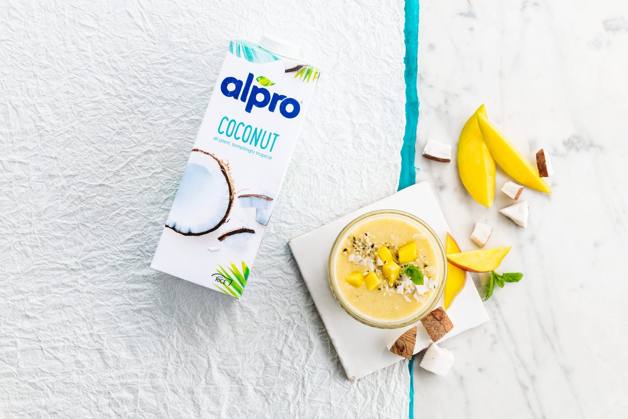 17BAC1F8-4017-46CA-ADDA8A9A425D7856<br>A_GFY_NA_Master_Recipe_Image_YellowCoconutIslandSmoothie_2x3__Drinks_NA_Coconut_NA_TetraUHT_1l_HR_ horizontal-036.tif<br>Coconut Sunshine Smoothie
It’s summer all year round with this lush smoothie made with Alpro Coconut Original drink
"200ml Alpro Coconut Original drink

85g mango, chopped

60g banana, chopped

1.5g fresh mint"
"1. Pop all that luscious fruits and mint into your blender
2. Add the Alpro Coconut Original
3. Zizz until smooth, creamy and golden
4. Pour into a chilled glass, garnish with an extra sprig of mint, sip slowly and enjoy that desert island feeling!"
lactose free, veggie, vegan, gluten free
/yellow-coconut-island-smoothie
(Recipe type: smoothies (Prep time: 10 min) (servings: +/- 1 persons) (season: all year) (pool: 1) NOT TO BE TRANSLATED