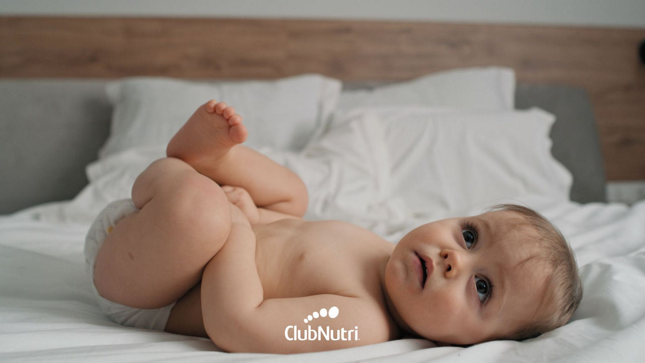 Breastfeeding baby on bed