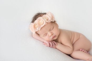 sleeping newborn baby on a blanket