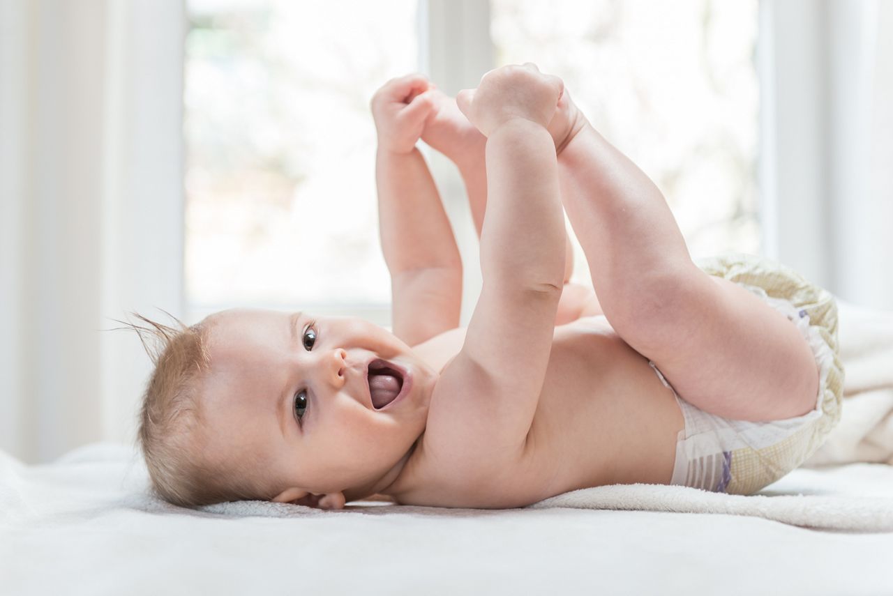 Cute baby girl smiling cheerfully