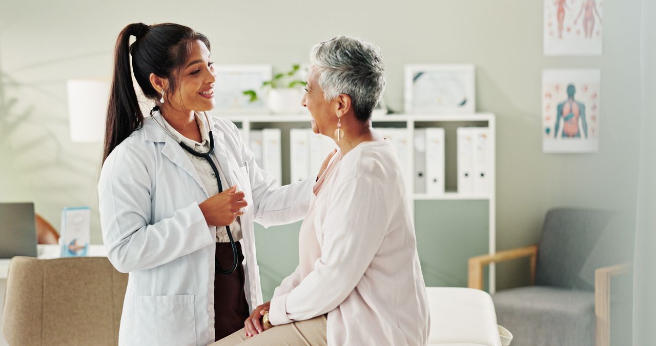 Woman, doctor and mature patient for consulting, support or conversation with checkup appointment in office. Female person, medical professional and healthcare talk for senior customer at clinic.