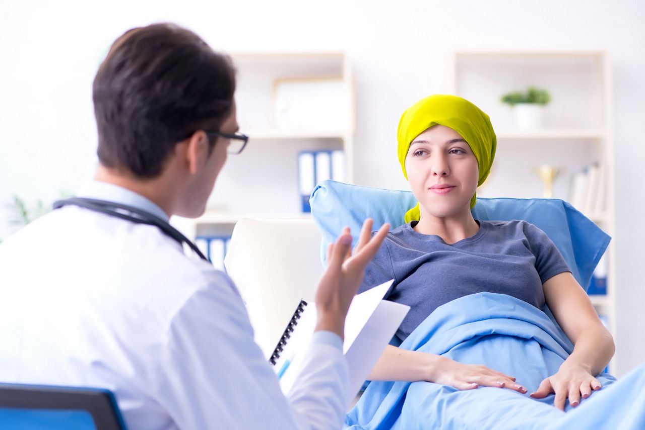 Cancer patient visiting doctor for medical consultation in clinic