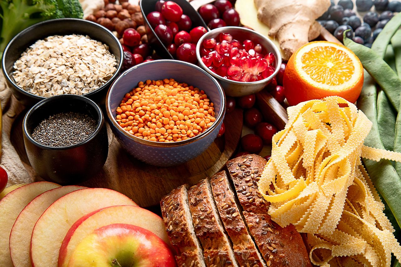 High fiber food for healthy bowel on a white background. Healthy balanced dieting concept. Top view.