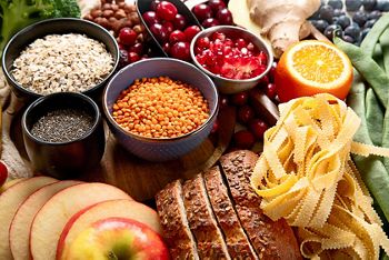 High fiber food for healthy bowel on a white background. Healthy balanced dieting concept. Top view.
