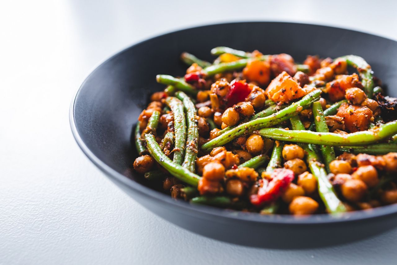 warm chickpea salad with green beans bell pepper and pumpkin, plant-based  healthy vegan food recipes