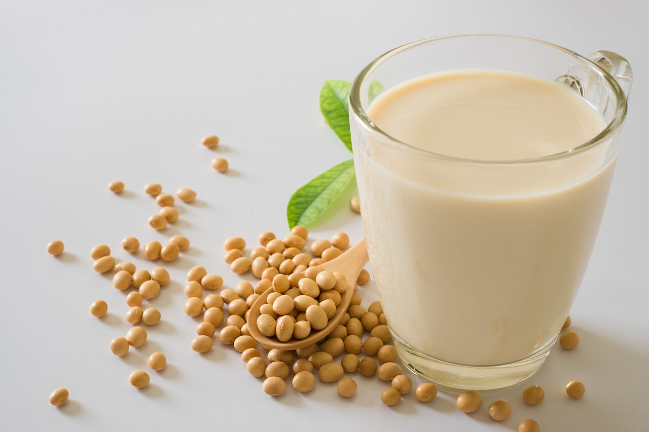 Soy milk and soy bean it on white table background,healthy concept. Benefits of Soy. protein drinking.