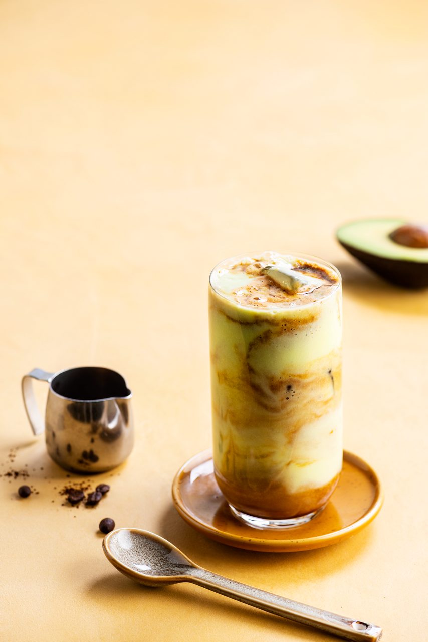 9E3F8558-46B8-4E42-B0878D619C38A6A1<br>A_NA_NA_Master_Recipe_Image_Avocadoicedlatte ___Recipe_NA_Drinks_origins_Oat_NA_TetraUHT_1l_HR_-040.tif<br>avocado_iced_coffee_title	Avocado iced coffee
avocado_iced_coffee_subtitle	The chilled coffee that's cool right now.
avocado_iced_coffee_ingredients	"½ avocado
500ml Alpro Barista Oat drink
1 tsp vanilla essence
1 espresso coffee
Ice cubes"
avocado_iced_coffee_preparation	"1 Use a stick blender to whizz the avocado and Alpro Barista Oat drink together in a jug until super-smooth and creamy.
2 Tumble a few ice cubes into a glass and add the vanilla essence.
3 Pour the avocado preparation over the ice, and top with a freshly brewed espresso.
4 Fire and ice, dark and light. Enjoy!"
avocado_iced_coffee_tags	veggie, vegan, lactose free, gluten free
avocado_iced_coffee_url	/avocado-iced-coffee
avocado_iced_coffee_info	(Recipe type: DRINK (Prep time: 2 min) (servings: for 1 person ) (season: All season)
avocado_iced_coffee_lactosetip	/
avocado_iced_coffee_veggietip	/
avocado_iced_coffee_trendtip	/
avocado_iced_coffee_glutentip	/
avocado_iced_coffee_product	Alpro Barista Oat drink
avocado_iced_coffee_searchterms	Alpro, Alpro recipe, avocado drink, avocado coffee, oat drink, iced coffee trendy drink
