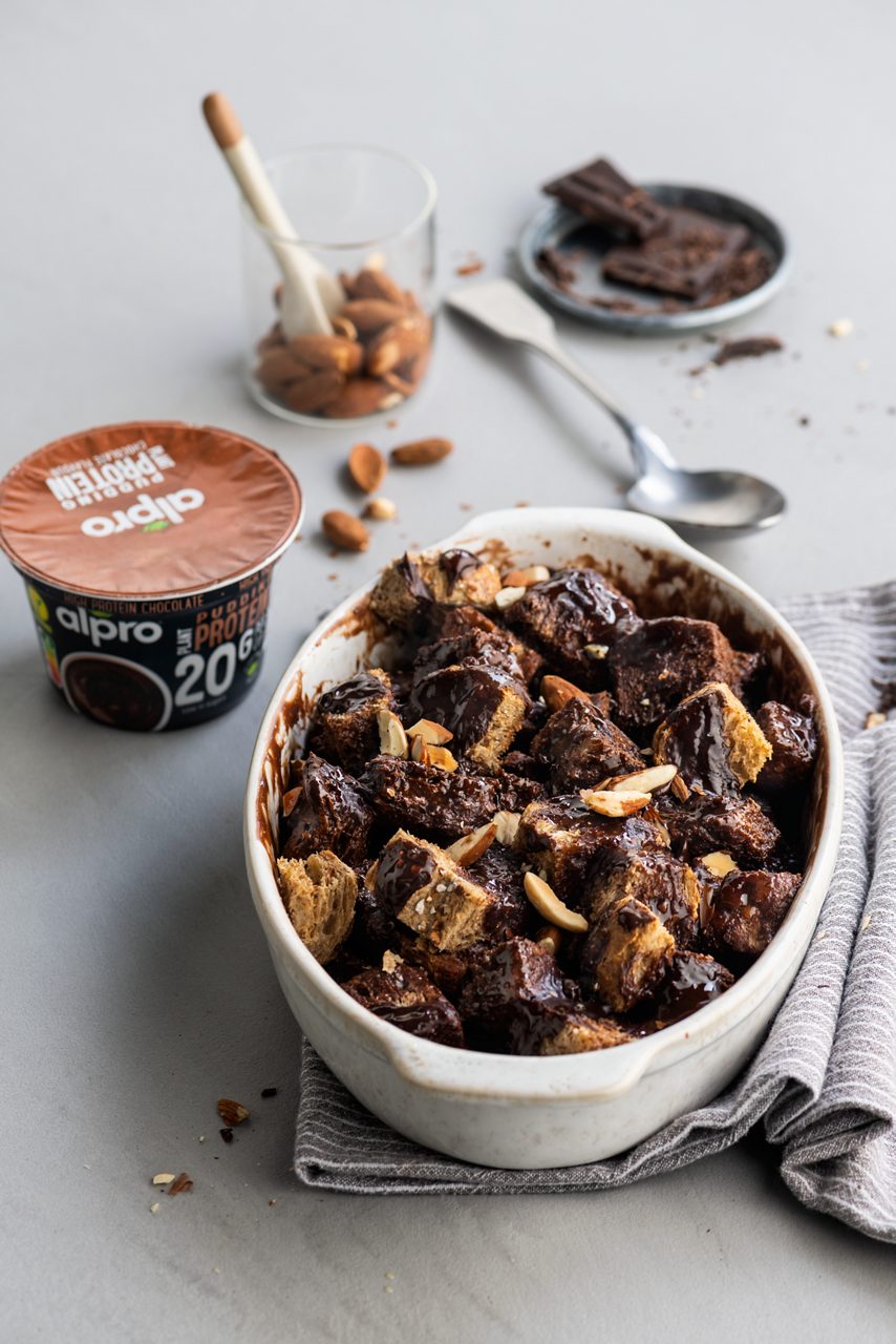 B4FEFB05-E242-4DFF-B639A676CBBDD4E0<br>A_FYY_NA_Master_Recipe_Image_BakedBreadPudding _NA_Desserts_HighProtein_Soy_Chocolate_Pot_250g_HR-217.tif<br>chocolate_bread_pudding_title	Chocolate bread pudding
chocolate_bread_pudding_subtitle	made with Alpro High Chocolate Protein Pudding 20g
chocolate_bread_pudding_ingredients	"
Oil
Alpro High Chocolate Protein Pudding 20g
slices whole wheat bread

Topping:
Nuts, cacao nibs or chocolate chips
Gluten free granola"
chocolate_bread_pudding_preparation	"""Grease a loaf pan or an 8x8 baking dish well with oil (can also line with parchment paper)
Place the bread pieces in the pan
Pour the Alpro High Chocolate Protein Pudding 20g over the bread pieces. Use a rubber spatula to mix and make sure all pieces are coated in the chocolate mixture.
Bake at 325 for 40-45 minutes, or until set in the middle.
Scoop into bowls and serve  """
chocolate_bread_pudding_tags	veggie, vegan, lactose free
chocolate_bread_pudding_url	/chocolate-bread-pudding
chocolate_bread_pudding_info	(Recipe type: DESSERT (Prep time: 10 min) (baking time: 40-45 min)  (servings: for 2 ) (season: all seasons)
chocolate_bread_pudding_lactosetip	/
chocolate_bread_pudding_veggietip	/
chocolate_bread_pudding_trendtip	/
chocolate_bread_pudding_glutentip	use gluten free bread
chocolate_bread_pudding_product	Alpro High Chocolate Protein Pudding 20g
chocolate_bread_pudding_searchterms	Alpro, Alpro recipe, pudding, bread, protein, chocolate