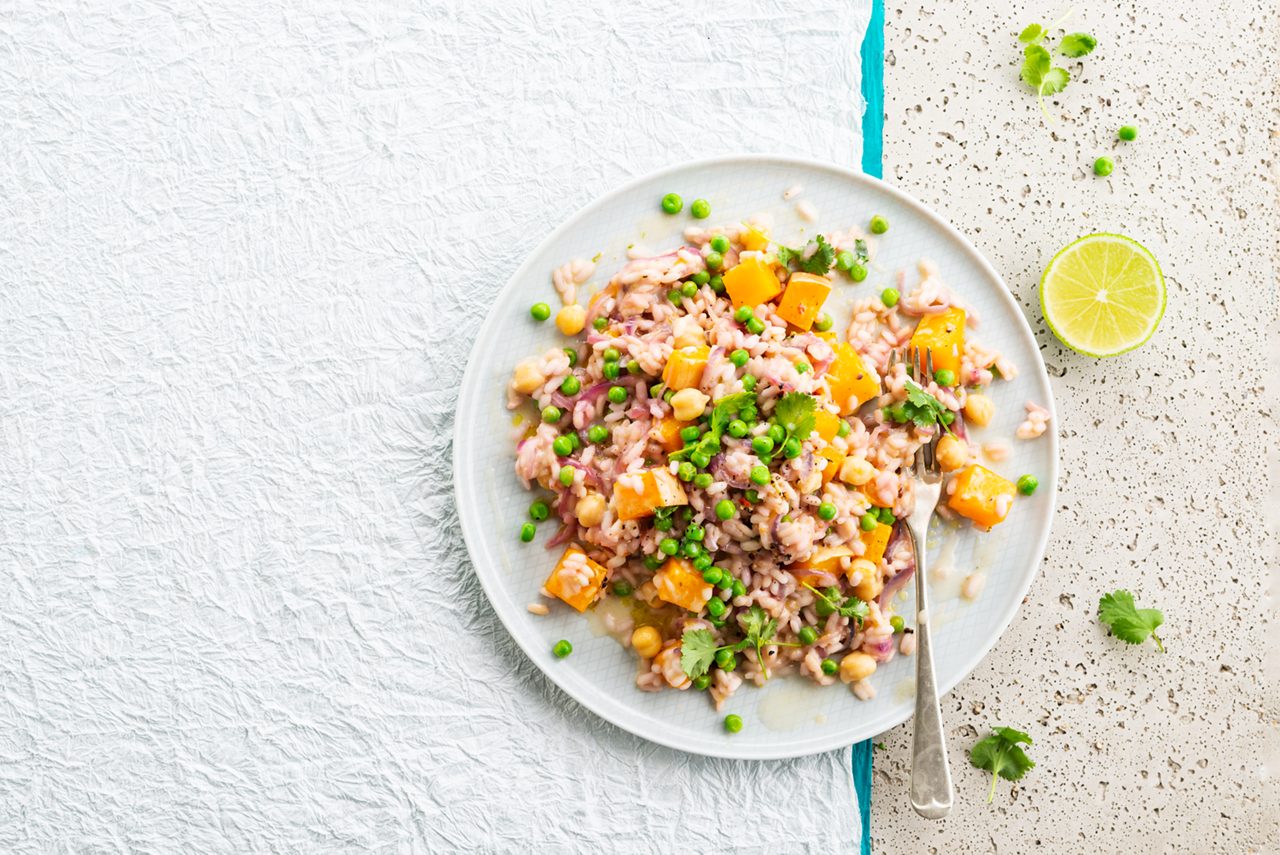 78402C84-F60D-4D0B-B6E7B53BFECF56F2<br>A_GFY_NA_Master_Recipe_Image_SquashRisotto_3x4__Drinks_NS_coconut_NA_TetraUHT_1l_HR_horizontal-046.tif<br>Spiced Chickpea and Squash Risotto 
An aromatic one-pot wonder made with Alpro Coconut Drink Original 
"45ml (3 tbsp) vegetable or mild olive oil
2 large red onions, finely sliced
3 cloves garlic, peeled & finely chopped
1 medium-hot chilli, deseeded & finely chopped
20g fresh root ginger, peeled and finely chopped (optional)
275g Alborio or Carnaroli risotto rice
900g squash or pumpkin, peeled, deseeded & cut into 1 cm cubes
250g leeks, cabbage or peas (or a mixture of them all)
1 vegetable stock cube dissolved in 500ml boiling water, kept warm on the hob
550ml Alpro® Coconut drink
400g can or carton chickpeas, drained & rinsed
Zest & juice of 2 limes
Salt & pepper, to season
Chopped fresh coriander to garnish"
"1. In a large saucepan, heat 30ml/2 tbsp of the oil and cook the onions over a low heat for 10 minutes, giving them an occasional stir. Cooking them long and slow like this makes them deliciously sweet! Then turn up the heat, add the garlic and chilli and cook for a further minute.
2. Now add the rest of the oil to the pan and pour in the rice, stirring well to make sure all the rice grains have a nice coating of oil. Add the squash or pumpkin and your choice of veggies and mix in.
3. And now, the secret of a successful risotto. Patience! Add the hot stock bit by bit, and keep on stirring over a medium heat until the rice has soaked it all up before adding more. So, start with 200ml of stock, then add the Alpro Coconut drink in the same way. It should take about 20-25 minutes.
4. Now pour in the chickpeas, the zest & juice of the limes and season to taste. Serve straightaway with a scatter of the chopped fresh coriander. It’s all the colours of autumn on a plate."
lactose free, gluten free, veggie, vegan
/squash-risotto
(Recipe type: MAIN (Prep time: 35 min) (cooking time: 25 min) (baking time: x min) (cooling time: x min) (servings: +/- 6 persons) (season: autumn) (pool: 1) NOT TO BE TRANSLATED
/
/
/
/
Alpro Coconut Drink Original
Alpro, Alpro recipe, main, risotto, pumpkin, squash risotto, pumpkin risotto, veggie risotto, italian