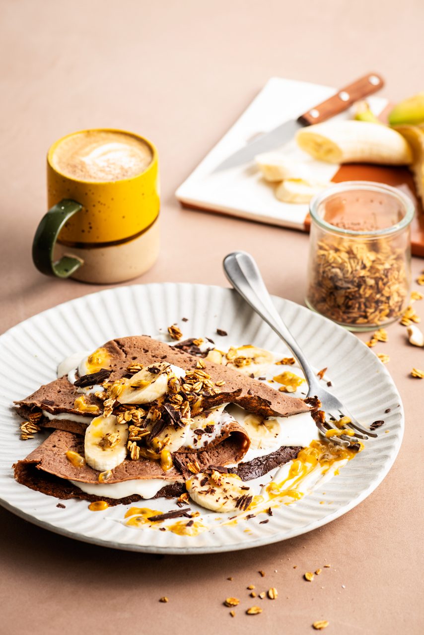 448C63CB-C498-440D-B8AE096DA8A74704<br>A_NotMilk_Product_Recipe_Image____Drinks_NA_Oat_NA_TetraUHT_1l_HR_NotMilk_chocolate_pancake-033.tif<br>"600 ml Alpro This is Not M*lk chocolate flavour
90 g Oat flour
90 g Rice flour
1 tbsp Baking powder
3 tbsp Cornflour
1 tbsp mixed seeds (flaxseeds, chia, sunflower seeds)
2 Banana’s 
120 ml water
To serve: Alpro plant based alternative to yoghurt of choice, granola, fruit of choice
"
"""Place the Alpro This is Not M*lk chocolate flavour, oat flour, rice flour, baking powder, cornflour, mixed seeds, banana and water in a blender and mix to a smooth batter. 
Heat a large crepe pan with coconut oil and bake the crepes till golden brown. 
Bake till all the batter is done. 
To serve the crepes: roll up or fold and serve with Alpro plant based alternative to yoghurt of choice, fruit and granola.
To have the ultimate combination, try Alpro plant based alternative to yoghurt coconut with banana, passionfruit and some chopped dark chocolate. 
"""
Vegan, lactose-free
/chocolate-flavour-breakfast-crepes-with-fruit-and-granola
(Recipe type: Breakfast (Prep time: 10 min) (baking time: 10 min) (cooling time: X ) (servings: for 8 large pancakes ) (season: all season)
xx
xx
xx
use gluten-free flour
Alpro This is Not M*lk chocolate flavour
Alpro, Alpro recipe, NOT MILK, chocolate, pancakes, banana, breakfast pancakes, crepes, lactose-free