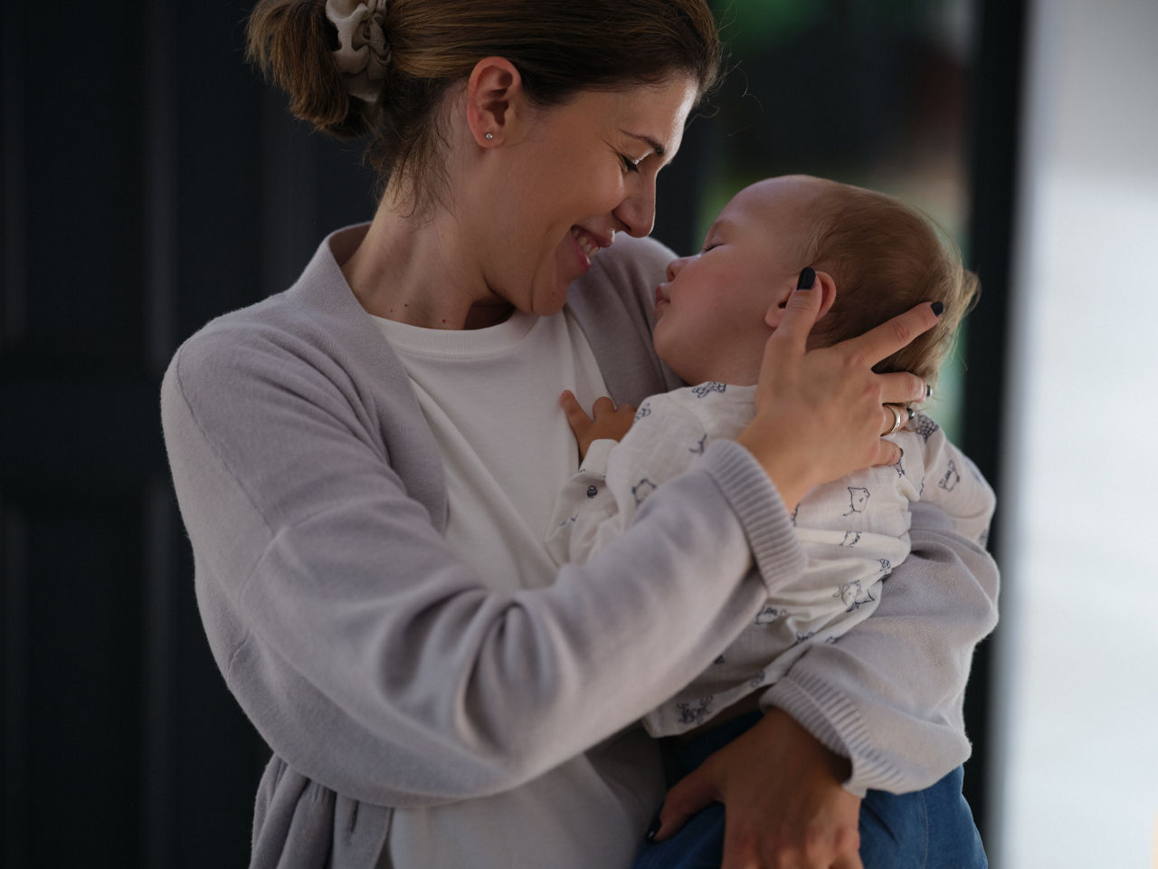 mom hugging baby