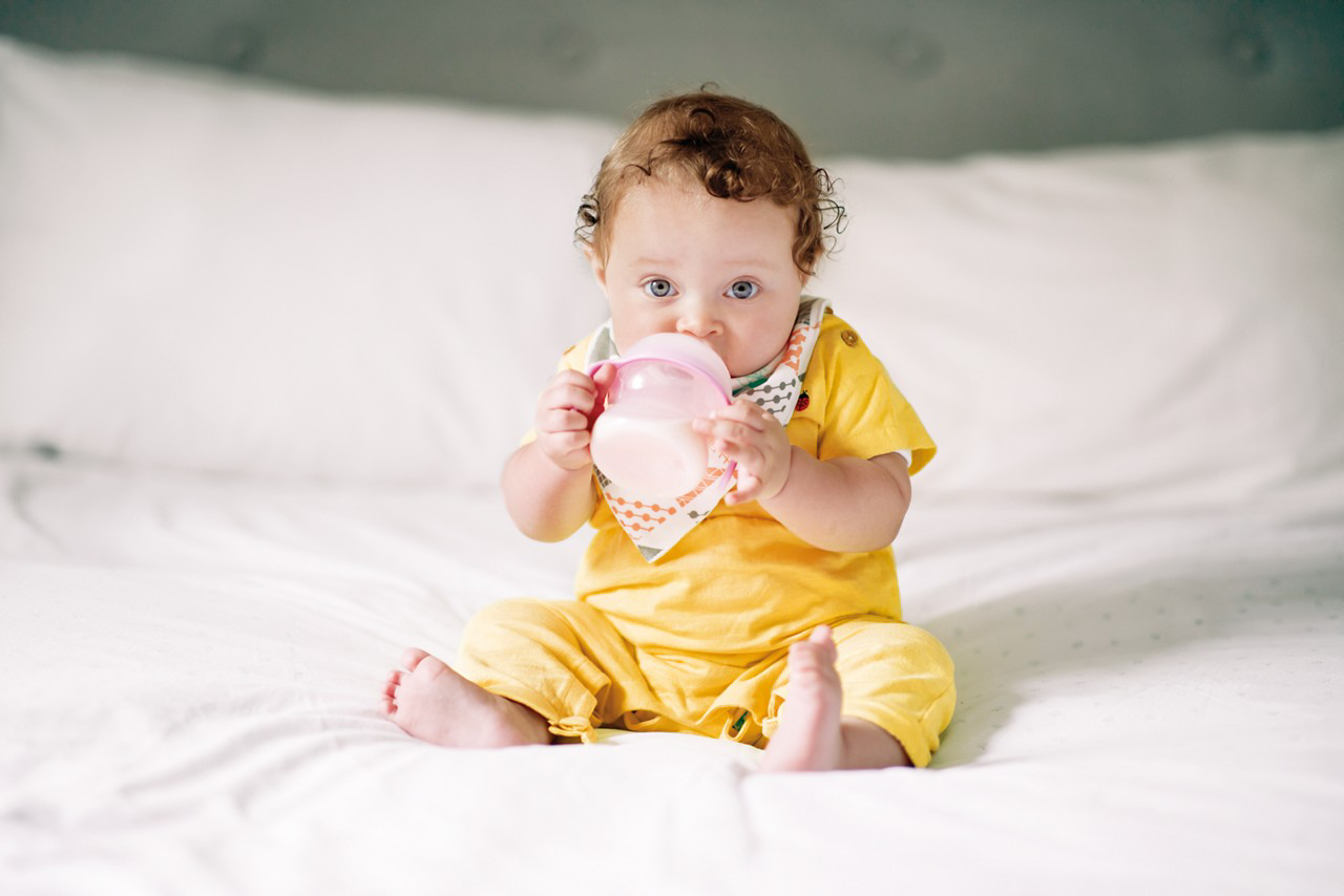 baby with bottle of milk