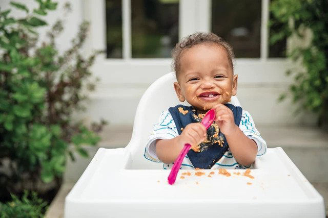 Baby with spoon