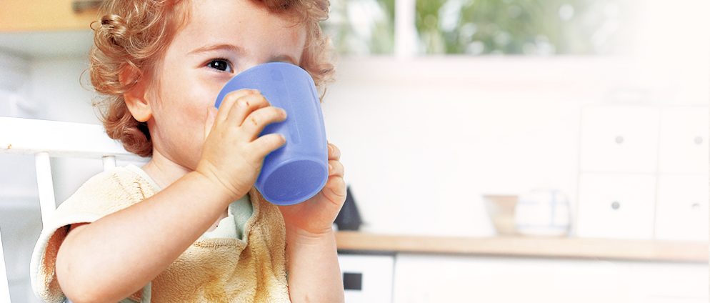 baby drinking from a cup
