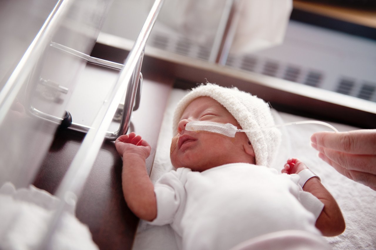 Mother taking care of his premature baby at hospital. Color and horizontal photo was taken in Quebec Canada.