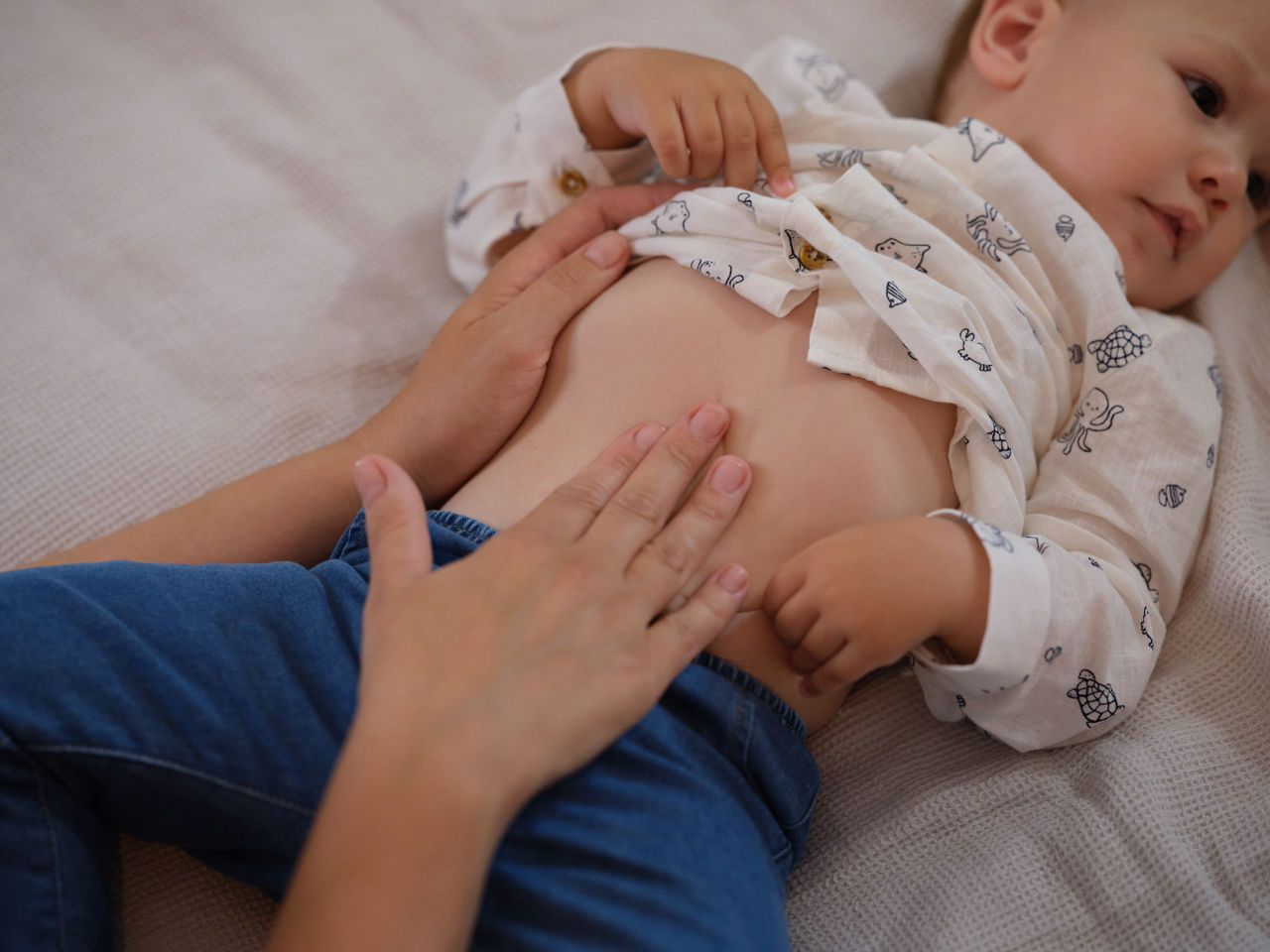 mom touching baby's belly