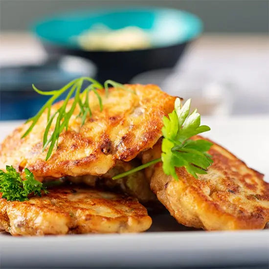 Golden potato pancakes with fresh herbs