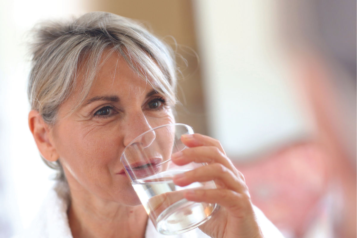 Dysphagia - Woman drinking a glass of water