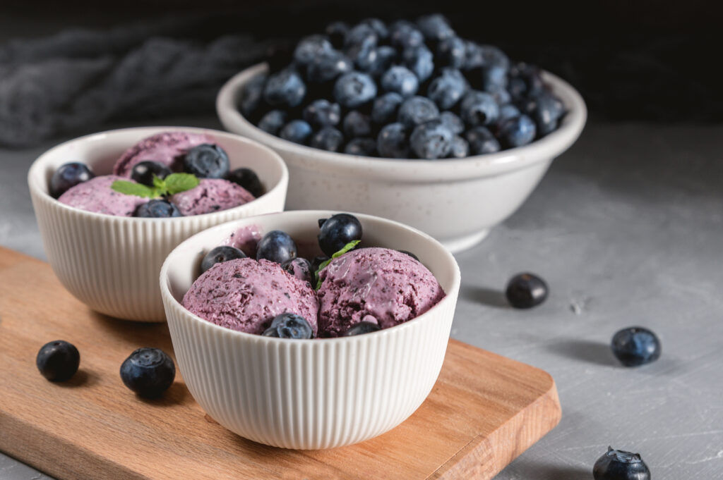 Ice-cream with blueberry and mint on rustic background