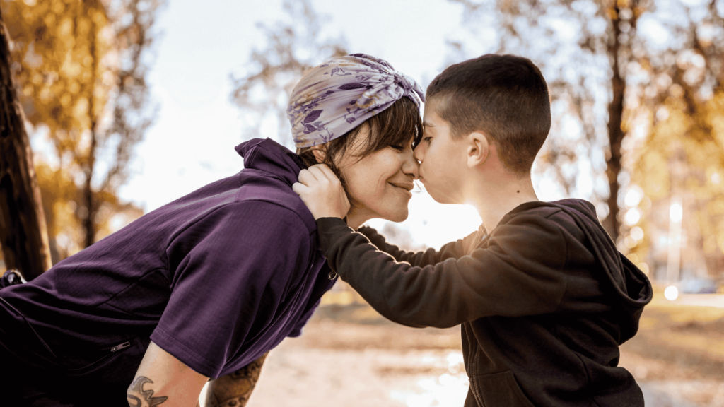 Mother and son embracing