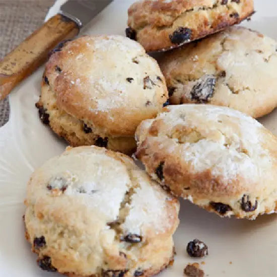 Freshly baked raisin scones on plate
