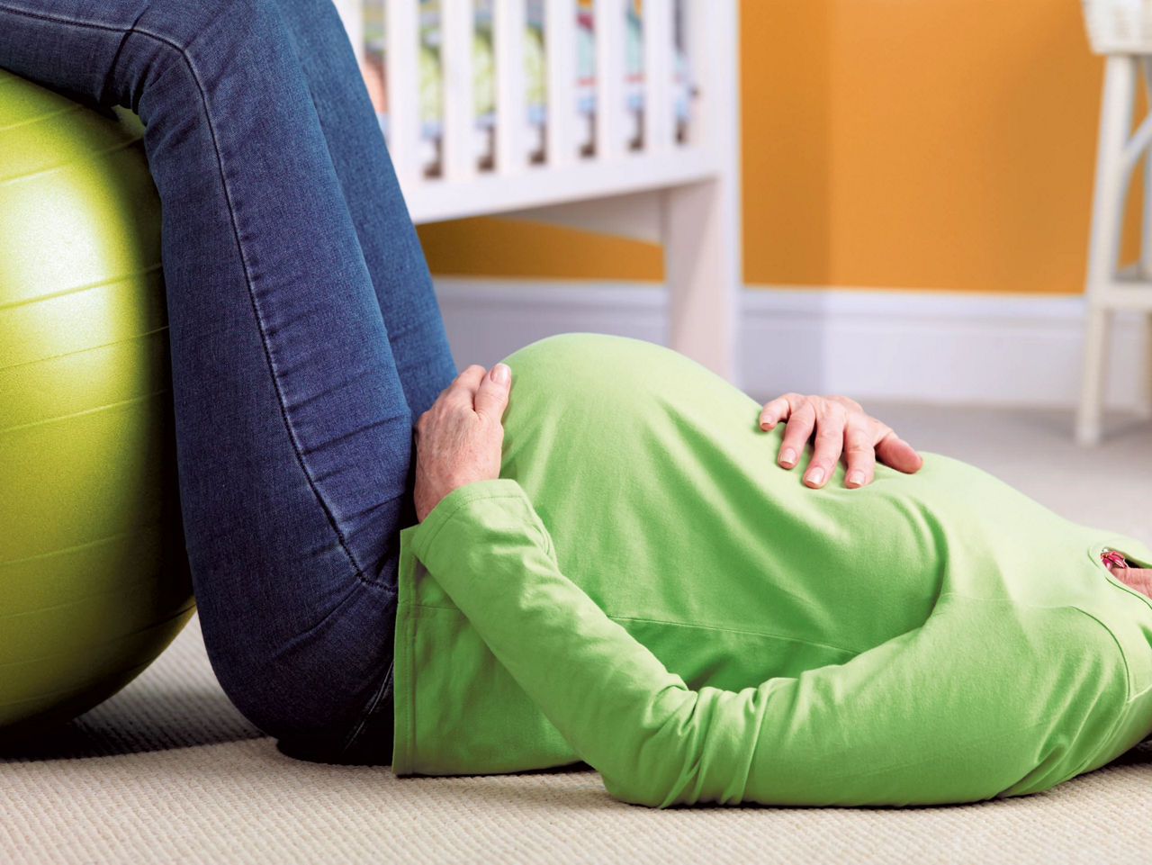 Pregnant woman laying on the floor