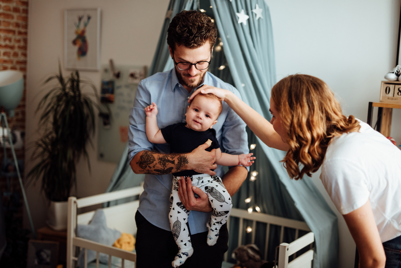 Parents playing with baby