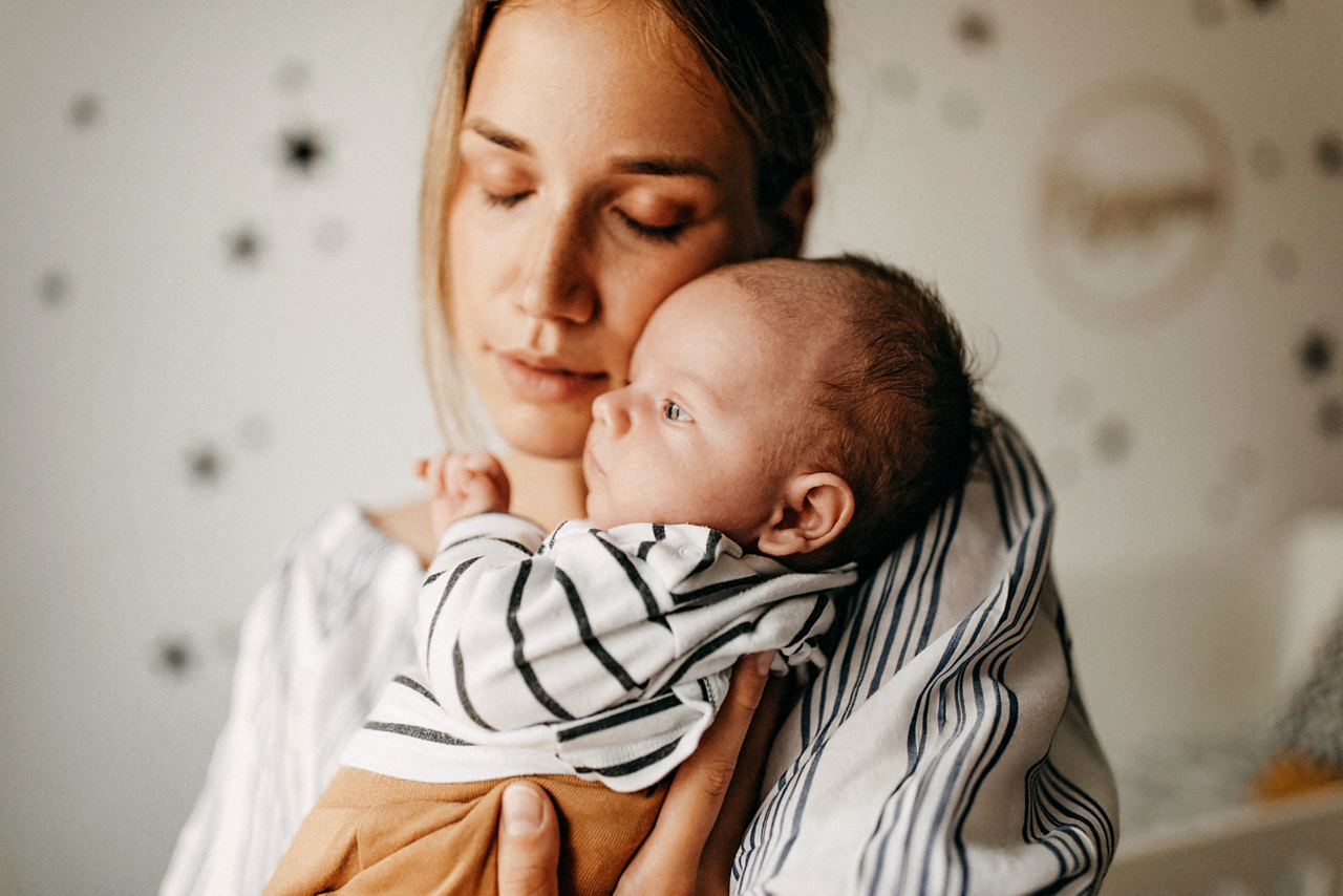 Mother playing with his baby son
