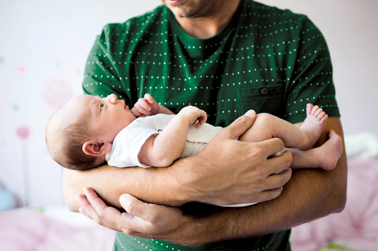 dad holding baby